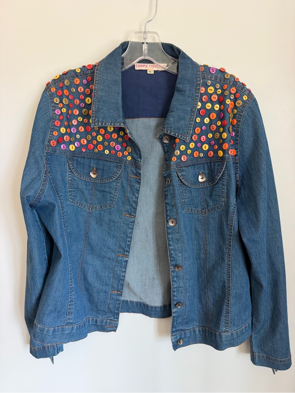 Blue Denim Jacket with Multicolor Button Accent Artsy